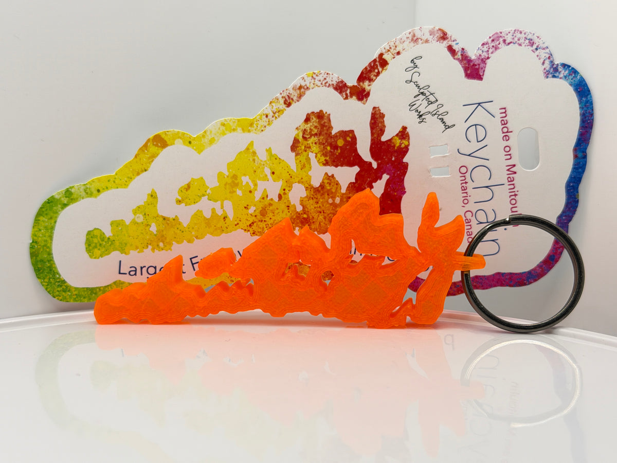 Translucent orange Manitoulin Island key chain on its display card