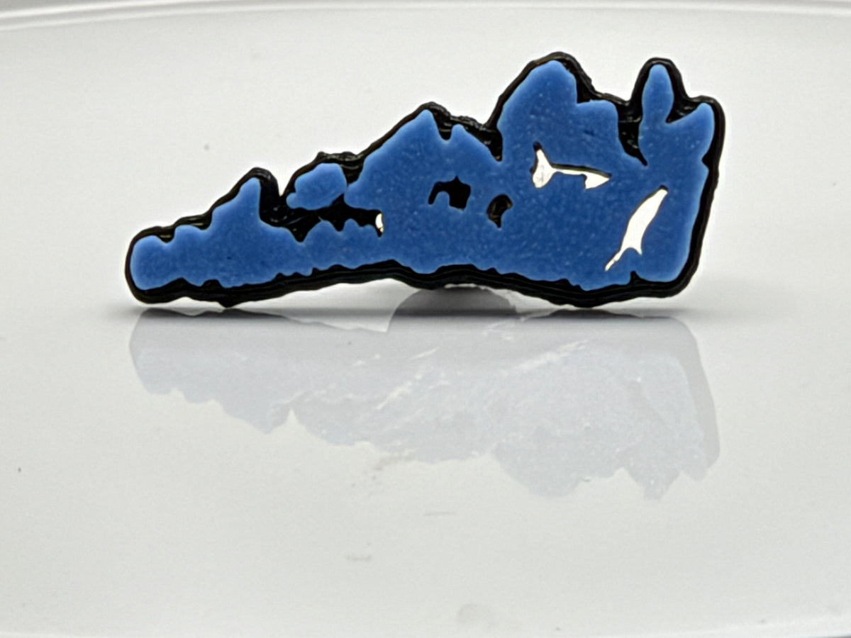 Blue Manitoulin Island shoe charm outside its bag