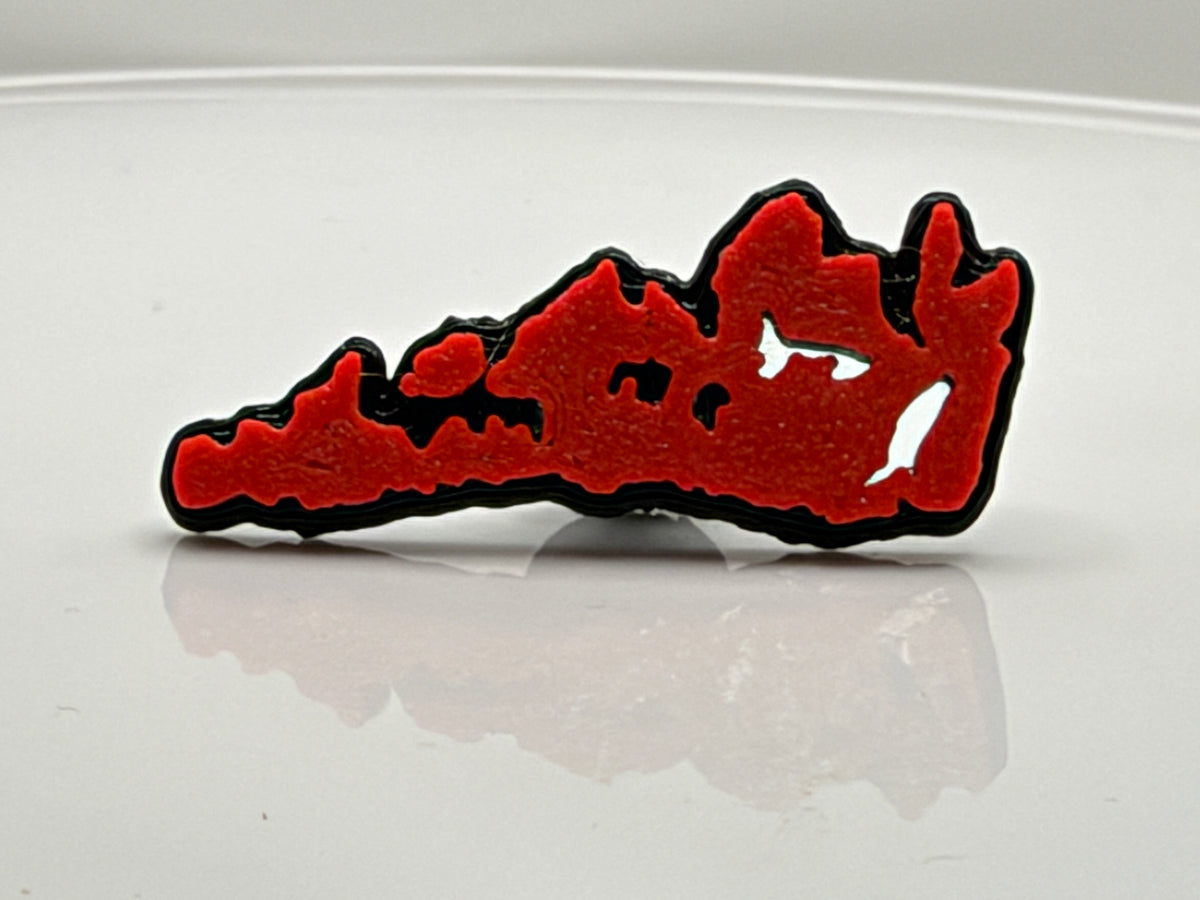 Red Manitoulin Island shoe charm outside its bag
