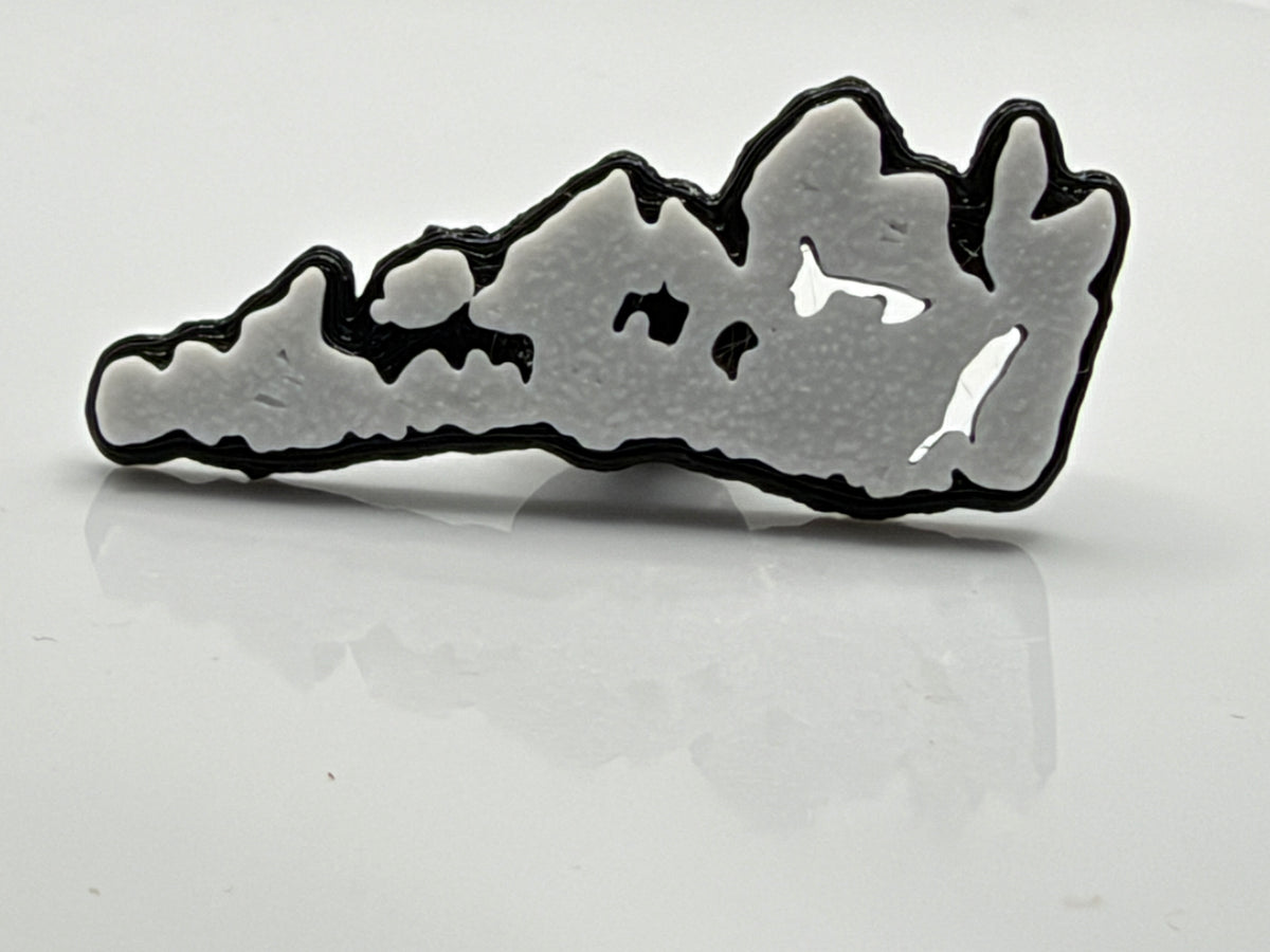 White Manitoulin Island shoe charm outside its bag