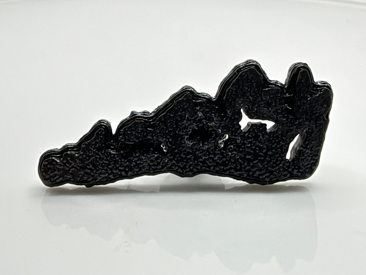 Black Manitoulin Island shoe charm outside its bag